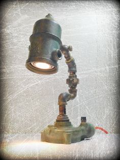 an old fashioned lamp on top of a table