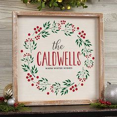 a christmas wreath with the words, the caldwells in red and green