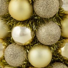 a christmas tree with gold and silver ornaments