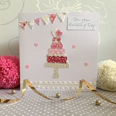 a pink card with a cake on it