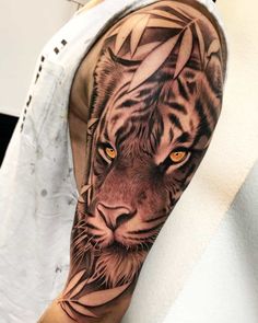 a man with a tiger tattoo on his arm