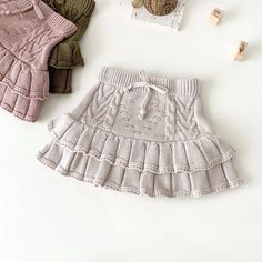 Your little cutie will be dressed to a 'T' in this precious chunky knit ruffled skirt! With its textured pattern, ruffles and elastic waistband, this Oat colored skirt will keep them comfy and stylish all the same. Baby Girl Clothes Winter, Ruffle Bloomers, Baby Girl Shorts, Ruffled Skirt, Pleated Shorts, Knitting Girls, Knitting For Kids, Baby Winter