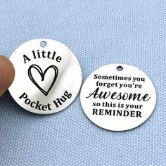 someone is holding two tags that say,'little pocket hubs are awesome so this is your reminder