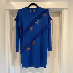 Love Moschino Sweater Dress. New With All Tags. Sized 40. Details Knitted, Sequins, Logo, Lam, Lightweight Knit, Round Collar, Solid Colour With Appliqus, Long Sleeves, No Pockets. There Are A Couple Small Snags On The Front Right Shown In Photos. Long Sleeve Blue Sweater Dress For Spring, Blue Cotton Long Sleeve Mini Dress, Blue Cotton Mini Dress For Fall, Blue Long Sleeve Cotton Mini Dress, Blue Crew Neck Winter Dress, Blue Cotton Crew Neck Dress, Blue Ruffled Winter Dress, Blue Winter Dresses With Ruffles, Blue Ruffled Dresses For Winter