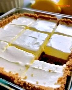 there is a cake that has been cut into squares and put in a pan on the table