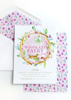 the woodland fairy birthday card is displayed on top of an envelope with flowers and leaves