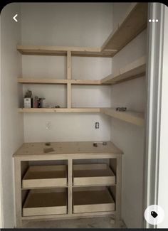 an empty closet with shelves and drawers