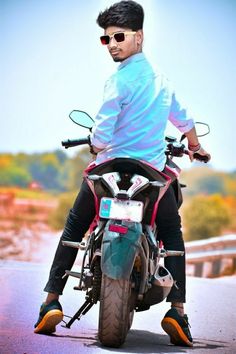 a man riding on the back of a motorcycle