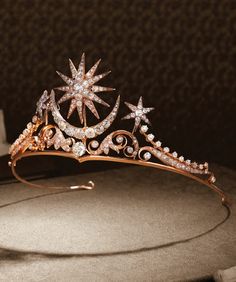 a tiara with stars and jewels on it