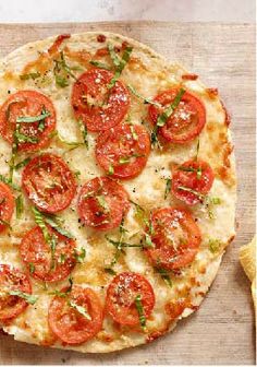 a pizza sitting on top of a wooden cutting board