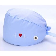 a blue hat with a red heart on it