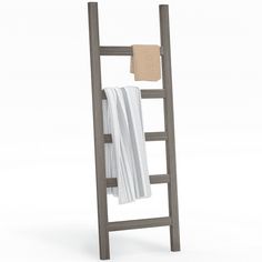 a towel rack with two towels hanging on it's sides and one folded up