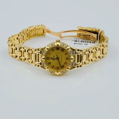 Women's Concord Sarento 24mm Solid 18K Yellow Gold Band Watch, with Roman Numeral Gold Dial, and Diamond Bezel. Includes Mahogany Box. Brand: Concord. Case Back: Solid. Gender: Women's. Condition: Pre-Owned. Dial Color: Yellow Gold. Case Dimensions: 24mm. Bracelet / Strap: Solid Gold. Bracelet Size: 5.3/4 (inches). Bezel Color: 18K Yellow Gold. Condition: Excellent Condition. Movement: Quartz (Movement). Metal Type: 18K Gold Solid Gold. Warranty: 1 Year Limited Warranty. Formal Gold Diamond Jewelry And Watches, Formal Gold Diamond Watch With Polished Finish, Gold Diamond Watch For Formal Occasions, Gold Diamond Watch With Polished Finish For Wedding, Gold Diamond Watch With Jubilee Bracelet For Formal Occasions, Formal Gold Diamond Watch With Jubilee Bracelet, Gold Round Diamond Watch For Formal Occasions, Luxury Gold Diamond Watch (hallmarked), Luxury Gold Diamond Watch Hallmarked