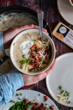 Baked potato soup in hands next to grass fed cheese Potato Soup Recipes, Baked Potato Soup Recipe, Baked Potato Soup, Potato Soup Recipe, Russet Potatoes, Crispy Bacon, Potato Soup, Green Onions