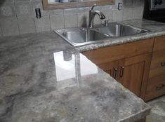 a kitchen counter top with a sink in it