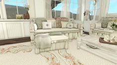 a living room filled with lots of white furniture and decor on top of a rug