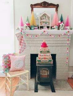 a christmas tree sitting in front of a fire place next to a fireplace with decorations on it