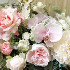 a bunch of flowers that are sitting on a table