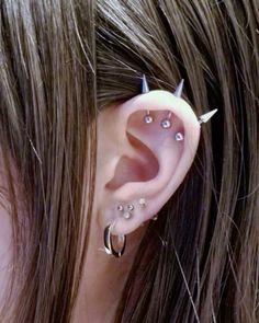 a person with some piercings on their ear