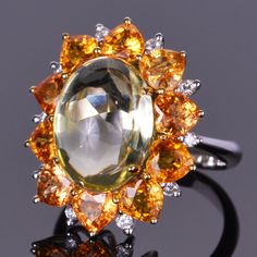 9.43 carat cabochon quartz set with 6.45 carats of stunning orange sapphires and .25 carats of diamonds in 14k white gold. Sapphire Antique Ring, European Cut Diamond Ring, Cognac Diamonds, Gold Diamond Band, Pave Diamond Ring, Orange Sapphire, Diamond Flower, White Gold Band, Vintage Jewels