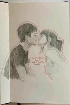 an open book with a drawing of two people kissing