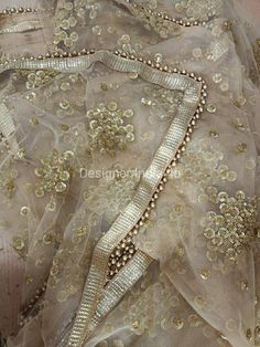 This is a Dupatta made on orders. It is made using golden color net fabric with gold sequine embroidery all over. We stitch a beautiful golden lace to all sides of it and decorate with tassels. Dupatta is having a length of 100 inches and width of around 40 inches. I don't keep it readymade I only make it exclusively for my customers. Can be fully customised. Dupatta For Lehenga, Lehenga Traditional, Golden Dupatta, Tassels Dupatta, Traditional Dupatta, Indian Dupatta, Designer Dupatta, Embellished Wedding Dress, Dupatta Style