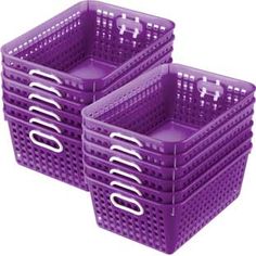 two purple plastic baskets with handles on each one and the other in different sizes, all stacked together