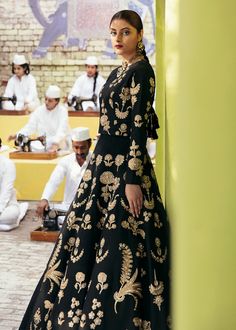 Pakistani Black Lehenga with Choli Wedding Dress is an elegant attire that is hand-crafted with lavish designs and embellishments. Premium raw silk fabric and aari work make this stunning Lehenga Choli your foremost priority to wear on the wedding day. Dupatta can be prepared on customized orders to give a traditional touch to the Lehenga Choli. Choli: Bridal choli in the black shade is gracefully emblazoned with shimmering goldwork. Lavish floral art and designs make this choli a perfect choice Aari Work Motifs, Walima Dresses Pakistani, Pakistani Mehndi Dress, Wedding Dresses Pakistani, Mehndi Dresses, Walima Dress, Black Lehenga, Raw Silk Fabric, Elegant Attire