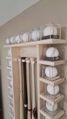 baseballs and bats are stored on shelves in a room