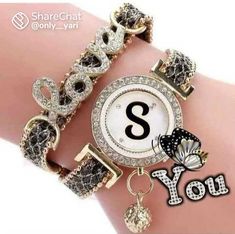 an image of a woman's wrist watch with the letter s on it and diamond bracelets