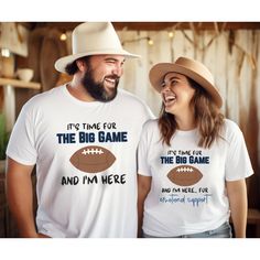 "Welcome to Epic Escape Essentials! Introducing our Football \"The Big Game\" couple t-shirts! There are two styles and each style comes in 3 colors - White, Sand, Sport Grey. Comfortable, sturdy and the perfect apparel whether watching the game live in person or in front of the big screen! 🏈 🔎Find other Epic travel apparel and accessories here ➡  https://epicescapeessentials.etsy.com T-SHIRT INFORMATION (Sizes S - 5XL) *Made with medium fabric (5.3 oz/yd² (180 g/m consisting of 100% cotton for year-round comfort that is sustainable and highly durable.  *The classic fit of this shirt ensures a comfy, relaxed wear while the crew neckline adds that neat, timeless look that can blend into any occasion, casual or semi-formal.  *The tear-away label means a scratch-free experience with no irri Bf Football Shirts, Football Couples Shirts, Gf Shirts For Football, Cute Football Gf Shirts, Customizable Casual T-shirt For Football Season, Girlfriend Humor, Football Tees, Sports Games, Football Funny