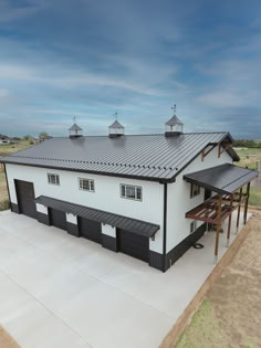 white and black barndominium All Black Metal Building, Barndominium Black And White, White Barndominium Black Trim, White Shop With Black Trim, White And Black Shop House, White Shop House, Black And White Pole Barn, White And Black Barndominium, Black And White Barndominium