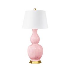 a pink lamp with a white shade on it