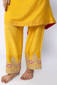 Mustard kurta with zari thread, sequin placement embroidery in floral pattern. Paired with inner and pant. - Aza Fashions Fitted Pants With Zari Work For Festivals, Festival Fitted Pants With Zari Work, Festive Bottoms With Zari Work For Festivals, Zari Work Bottoms For Wedding And Festivals, Festive Fitted Pants With Zari Work, Festive Straight Pants For Diwali, Traditional Yellow Pants For Festive Occasions, Embroidered Bottoms For Wedding And Festivals, Chanderi Pant Set With Gota Work For Festivals