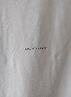 a piece of white paper with the words rebel with a cause written on it