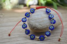 Blue eye is the color of good luck or good karma. This color projects positive energies such as creativity, motivation, commitment as well as protection against evil eye. Adjustable Evil Eye Bracelets For Meditation, Adjustable Spiritual Evil Eye Bracelet For Meditation, Spiritual Evil Eye Bracelet With 8mm Beads, Bohemian Evil Eye Bracelet For Healing, Handmade Spiritual Evil Eye Bracelet For Meditation, Symbolic Evil Eye Bracelet As Gift, Blue Adjustable Evil Eye Bracelet, Spiritual Evil Eye Beaded Bracelets, Adjustable Blue Evil Eye Bracelet