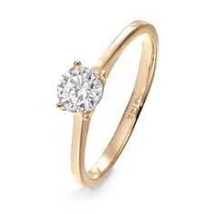 a yellow gold engagement ring with a single diamond