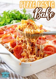 a pizza casserole is being lifted with a spatula