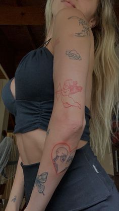 a woman with many tattoos on her arm