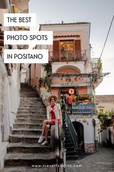 a woman sitting on the steps in front of a building