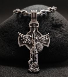 Silver medallion of the Archangel Michael. Made of 925 sterling silver. This handmade necklace will be a great gift and decoration for every day. The clear details of the necklace and the high quality of the piece will attract everyone's attention. ★Item Details * Gender : Male / Female * Material : 925K Sterling Silver * Pendant weight : 18 - 20 Grams * Pendant Diameter : 6.2 cm x 3.2cm (2.3622 x 1.1811 inc) * Bail Width : Suitable for up to 0,275591 Inc (7.00 mm) Chain * Chain Thickness : 0,15 St Michael Medallion, St Michael Necklace, Cross Pendant Men, Saint Michael The Archangel, Necklaces For Men, San Michele, Saint Michael, Archangel Michael, Mens Pendant