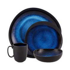 a blue and black dinnerware set on a white background