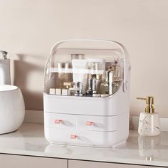 a white vanity with lots of cosmetics on it