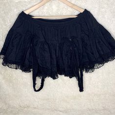 Vintage Tripp Nyc Xxl Skirt With Bows, Straps, And Skull Embellishments. Purchased From Hot Topic In The Early 2000’s. There Is Some Wear To The Lace And Tule Parts Of The Skirt But It Is Otherwise In Good Condition. Measurements Lying Flat: Waist: 16” Stretches To 24” Across Length: 11.5” From A Smoke Free Pet Friendly Home. I Reuse Packing Materials Whenever Possible. Tripp Nyc Skirt, Vintage Tripp Nyc, Skirts Vintage, Early 2000’s, Tripp Nyc, Vintage Skirt, Hot Topic, Pet Friendly, Embellishments