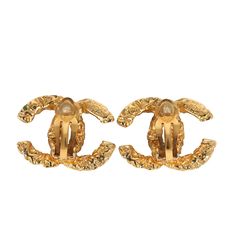 These 1993 Chanel vintage Florentine CC earrings are of 24K gold plated hardware, featuring a hammered-like lava effect and a clip on back closure.Origin: FranceCondition: Vintage; Excellent - These earrings show some discoloration on the backside and near the clip on closure.Accompanied by: Chanel boxMeasurements: 1" x .8" Gold Earrings For Formal Occasions, Gold Formal Earrings With Gold-tone Logo, Designer Gold Clip-on Jewelry, Gold Designer Metal Clip-on Earrings, Formal Gold-tone Metal Earrings, Designer Gold Metal Clip-on Earrings, Elegant Yellow Gold Earrings With Gold-tone Logo, Luxury Gold Clip-on Earrings For Evening, Luxury Hammered Gold Earrings