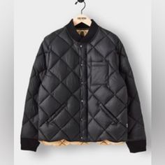 We’ve Long Loved The Comfort And Versatility Of Quilted Jackets, But We Wanted Something That Looked A Little Cooler Than Your Garden-Variety Puffer. So, Todd Took The Rugged Silhouette Of A Vintage Mountaineer’s Jacket From The 1960s And Gave It A Modern Refresh With A Diamond-Quilted Nylon Exterior That’s Made From Italian Fabric. The Filling Is Down, So You Can Wear This Layer Deep Into Winter (And Keep Comfy With A Ribbed Collar And Cuffs). 100% Italian Nylon Exterior 650 Fill Power Duck Dow Classic Black Quilted Jacket For Work, Black Quilted Jacket For Fall Outdoor, Classic Black Outerwear With Patch Pockets, Black Quilted Jacket With Pockets For Cold Weather, Black Fall Outerwear With Patch Pockets, Winter Black Sport Coat With Patch Pockets, Black Outdoor Outerwear With Patch Pockets, Black Quilted Outerwear For Work, Black Quilted Jacket With Pockets For Fall