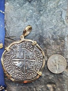 This coin is made from the silver bars recovered from the Atocha. I use moulds from the original coins to get the print. This is a replica but actually made from the silver from the Atocha. The frame around is SOLID 14KT GOLD. a large, heavy and beautiful piece of history Pirate Wench, Key West Fl, Antique Coins, Ancient Jewelry, Coin Jewelry, Shipwreck, Silver Coin, Silver Bars, Coin Necklace