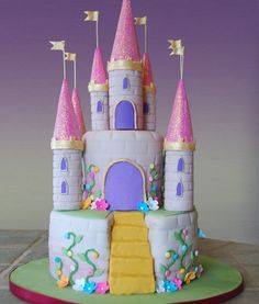 there is a cake that has been made to look like a castle with pink turrets