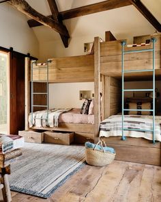 a bedroom with bunk beds and baskets on the floor