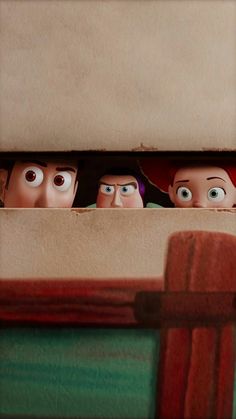 three cartoon characters peeking out from behind a cardboard box